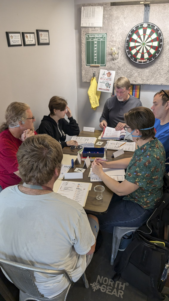People playing Triangle Agency, a table-top role-playing game.